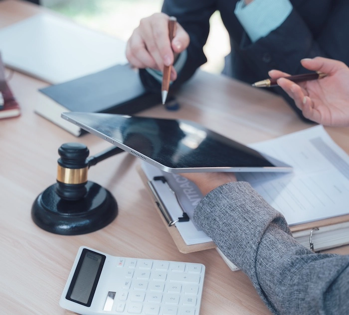 Client and lawyer examining credit report errors Client and lawyer examining credit report errors